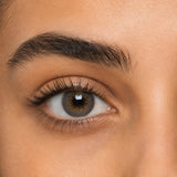 Desio Precious Grey coloured contact lens shown on a dark brown eye
