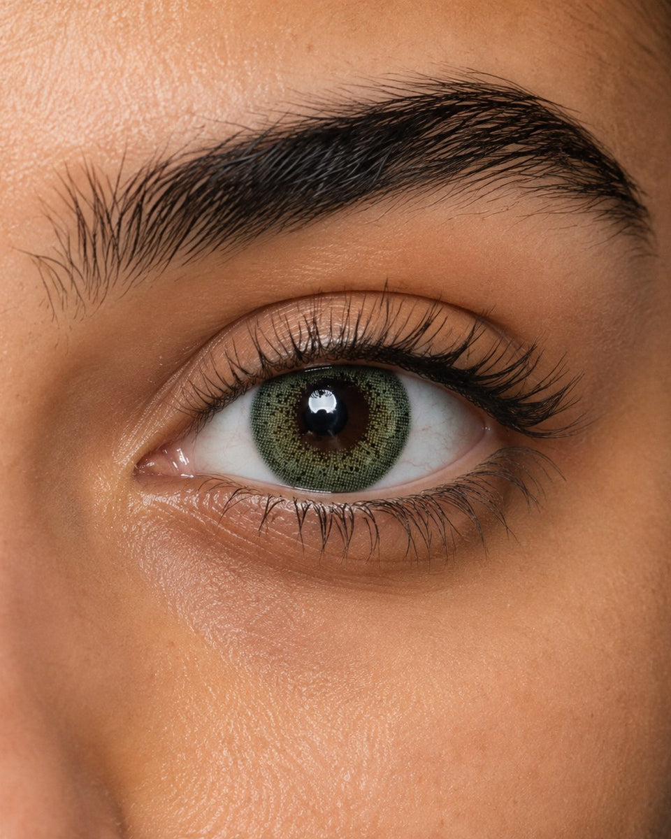 Fresh Lady Breeze Green coloured contact lens shown on a dark brown eye