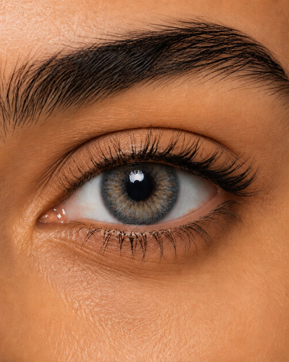Fresh Lady Lolite on a dark brown Egyptian eye — grey-blue with a warm gold centre