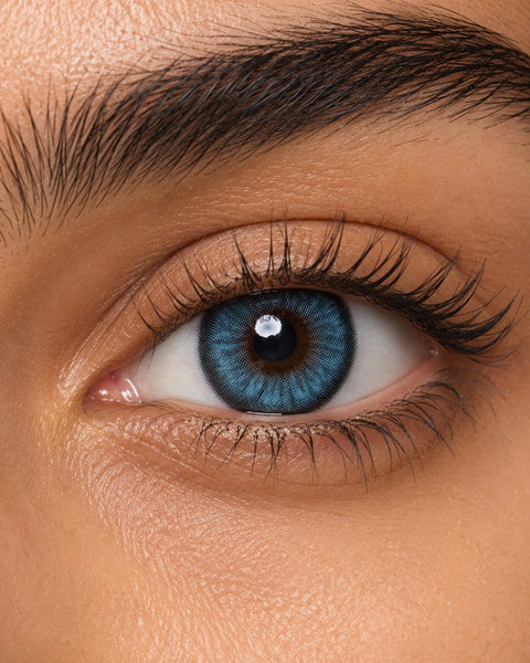 Fresh Lady Sky Blue coloured contact lens shown on a dark brown eye