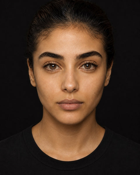 A barely-there brown lens shown on a dark brown Egyptian eye