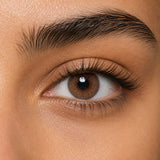 Urban Layer Angeles N Brown coloured contact lens shown on a dark brown eye