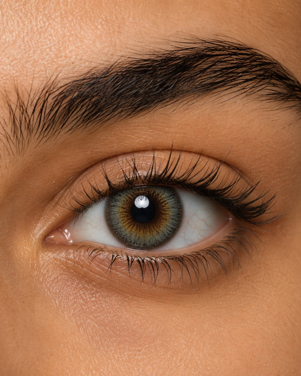 Urban Layer Breeze Gray coloured contact lens shown on a dark brown eye