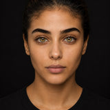 Urban Layer Cleopatra Green coloured contact lens worn by a model